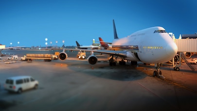 Plane waiting at airport gate