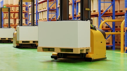 Automated forklift truck lifting goods on a palette in a smart warehouse