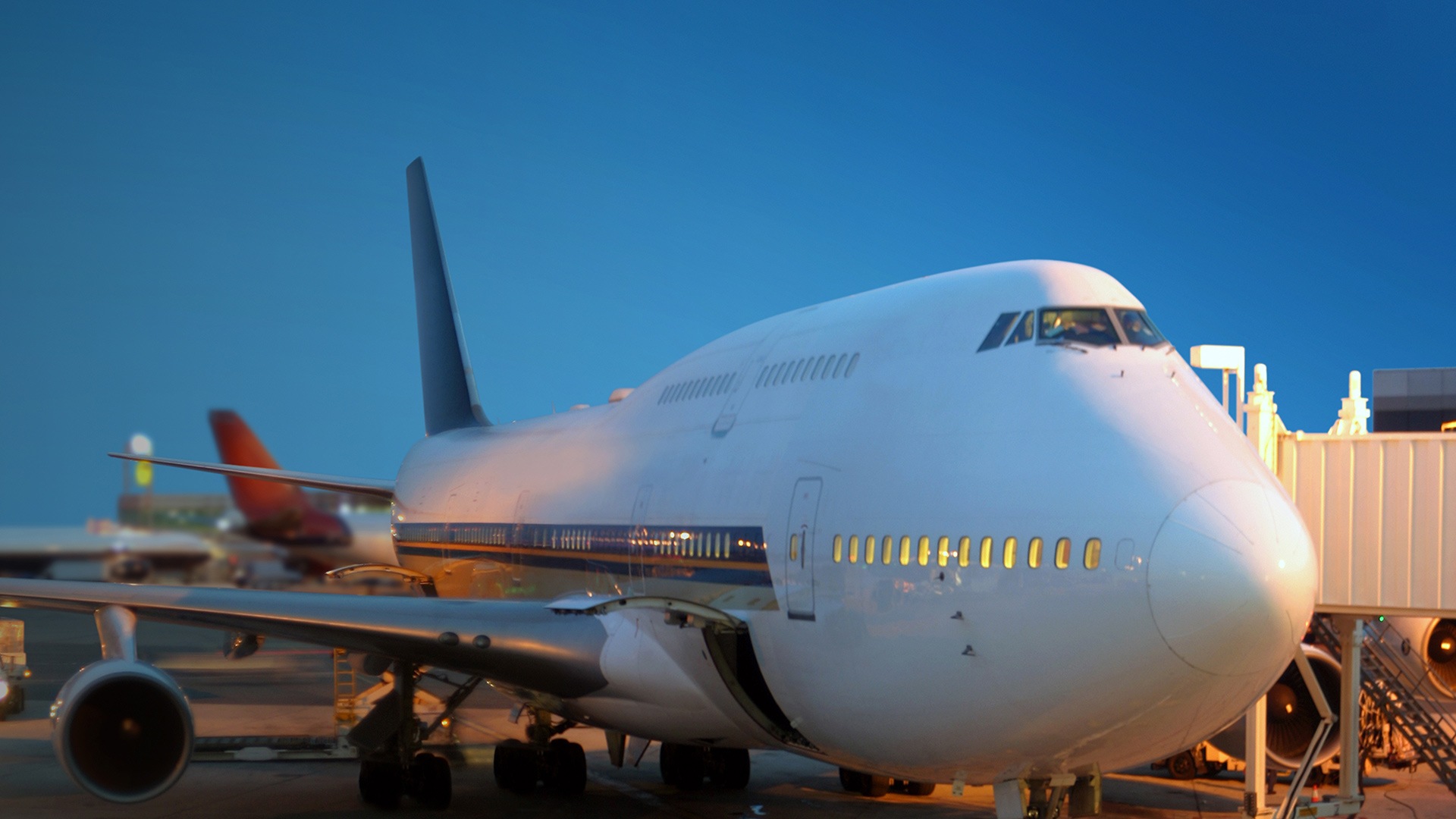 Passenger jet at gate with boarding tunnel attached