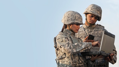 Two soldiers looking at a tablet device