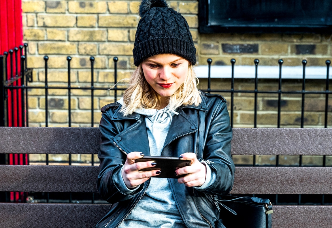 girl holding phone horizontally