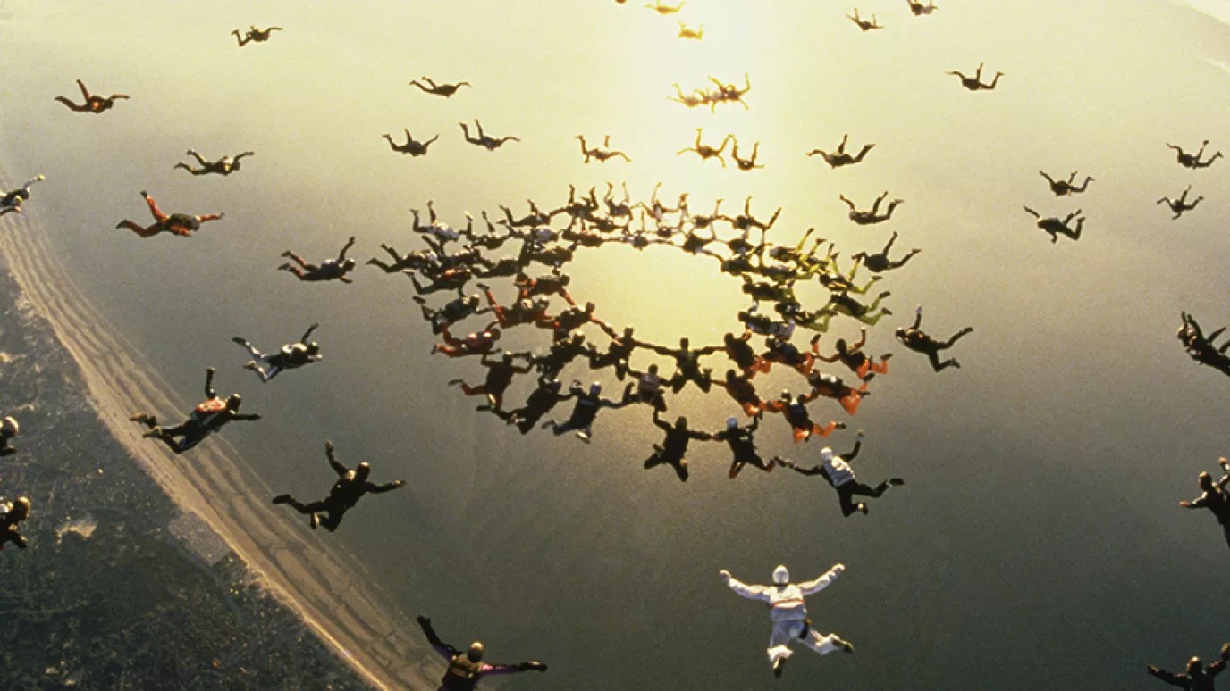 Skydivers in the clouds