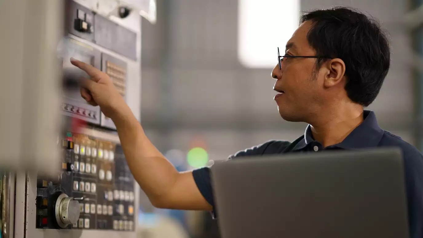 person working on a machine