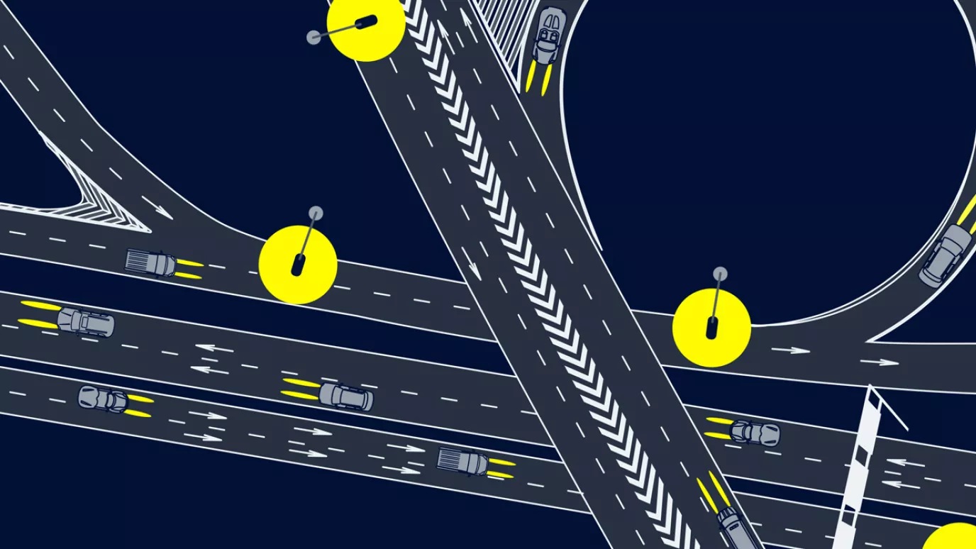 Illustration of overhead view of road system after dark with flyover