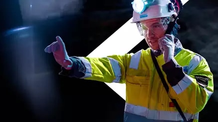 Emergency worker in hi-viz clothing on walkie talkie