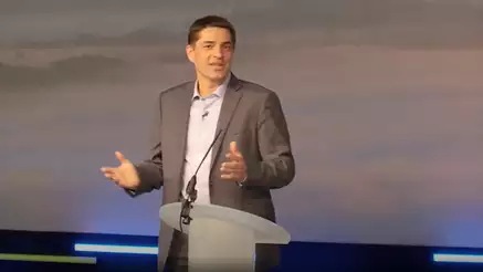 Sasa Nijemcevic presenting on stage