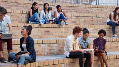 An image of people sitting on big stairs.