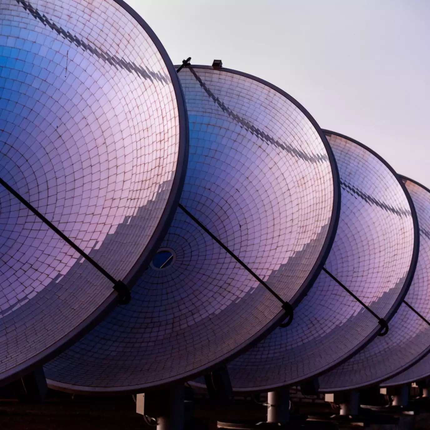 Four communications dishes in a row