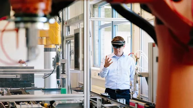 Man using smart glasses in factory