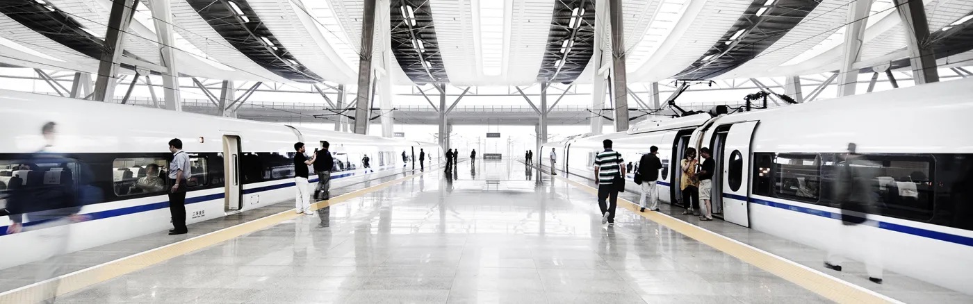 People boarding trains at train station