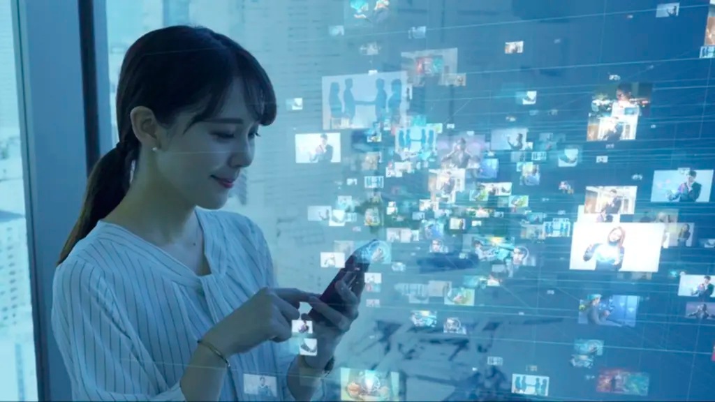 A woman using a smartphone in front of a window. The background is a blue, digital network of interconnected images.