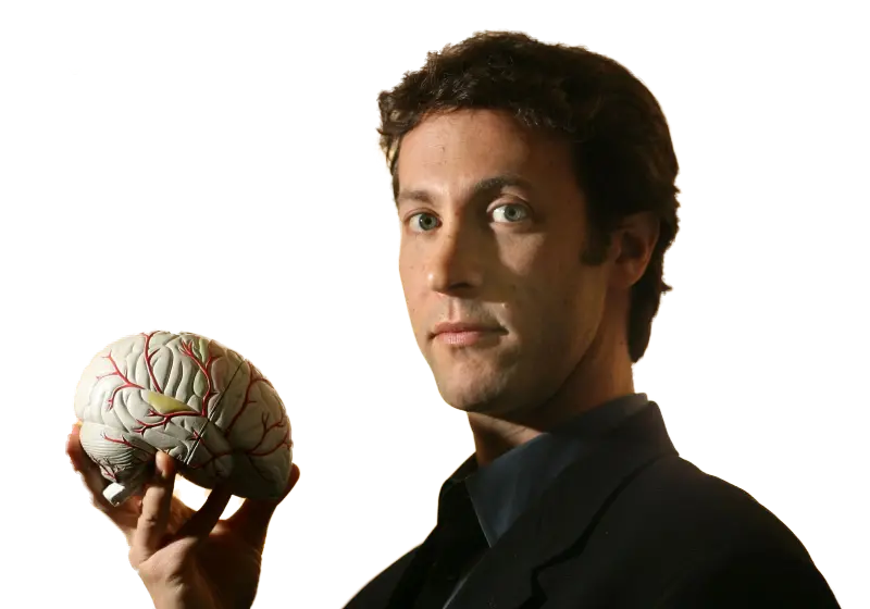 David Eagleman holding a model of a human brain