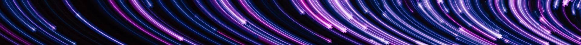 Optical fibres with purple light on dark background