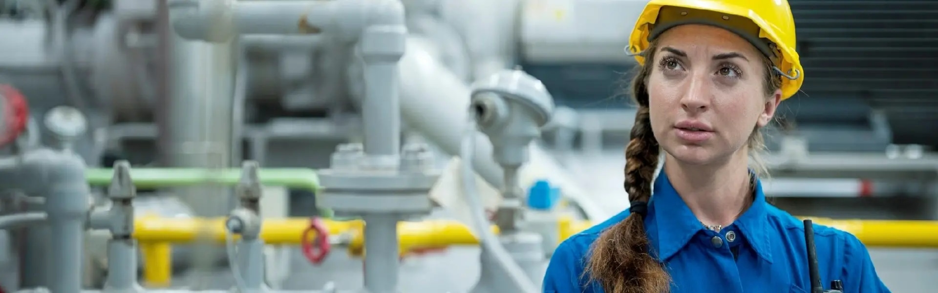 Woman in coveralls in a chemical manufacturing plant