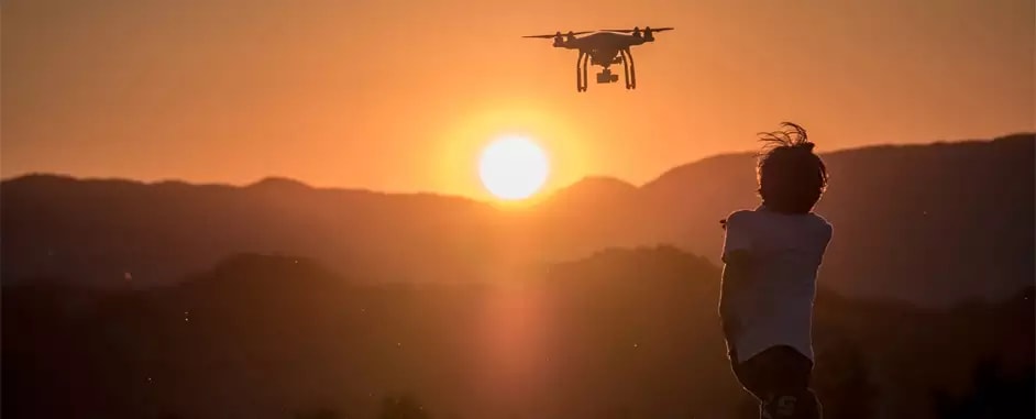 kid playing with drone