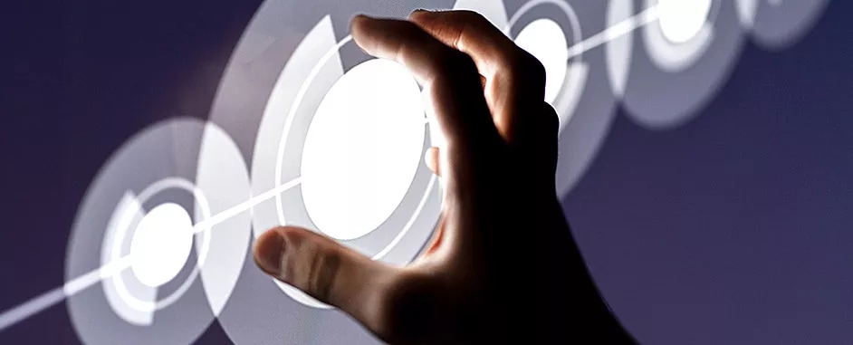 A hand reaching out to touch a digital circle.