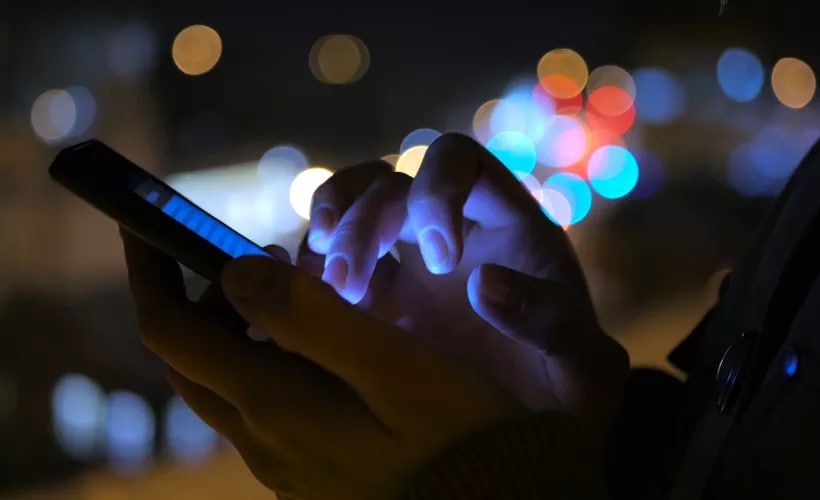 Close-up of a mobile device in hand