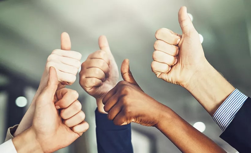Team giving thumbs up
