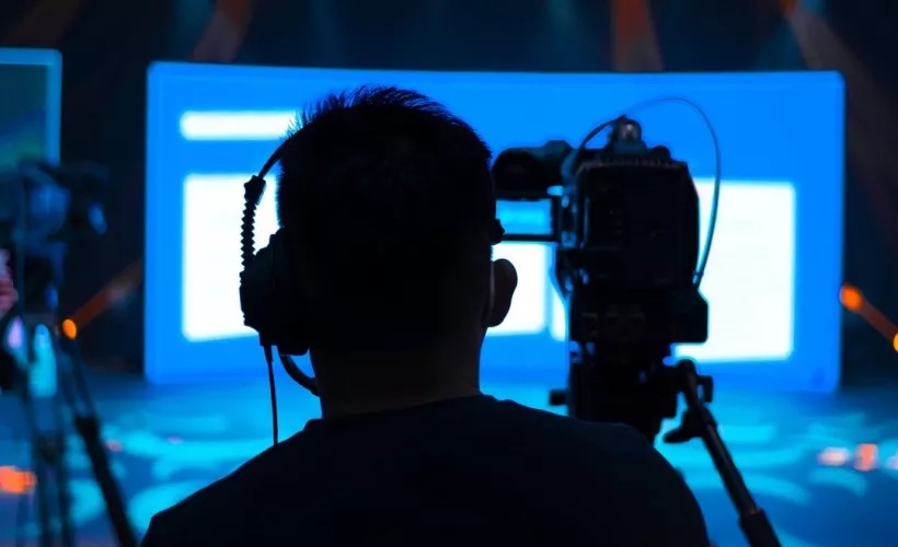 person behind a camera