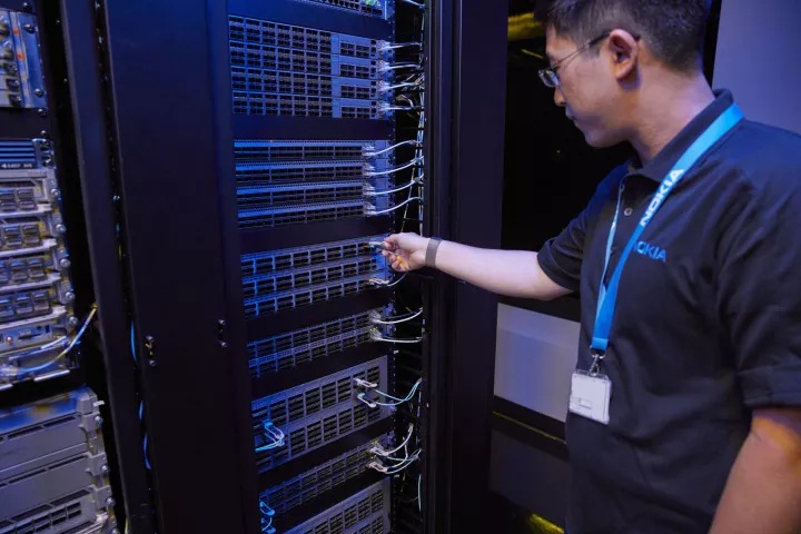 Nokia technicians working on IP routers