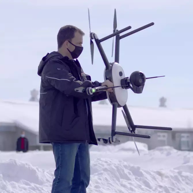 a person holding drone