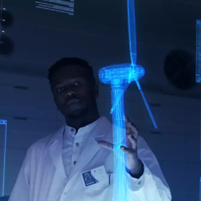 two engineers examine a digital twin of a wind generator