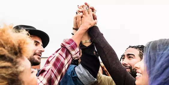 Friends holding hands
