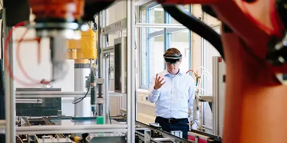 Man using smart glasses in factory