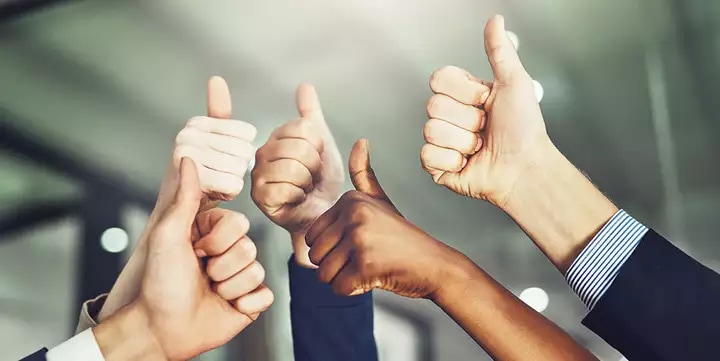 Team giving thumbs up