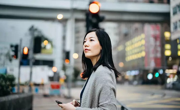 woman waiting at a signal
