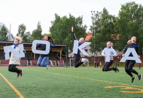 people carrying big letters