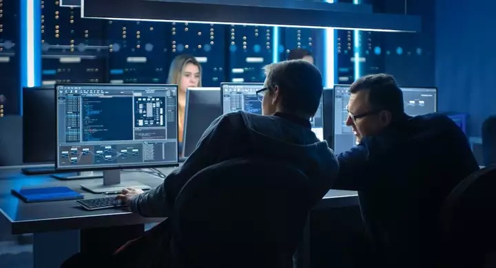 Two people working